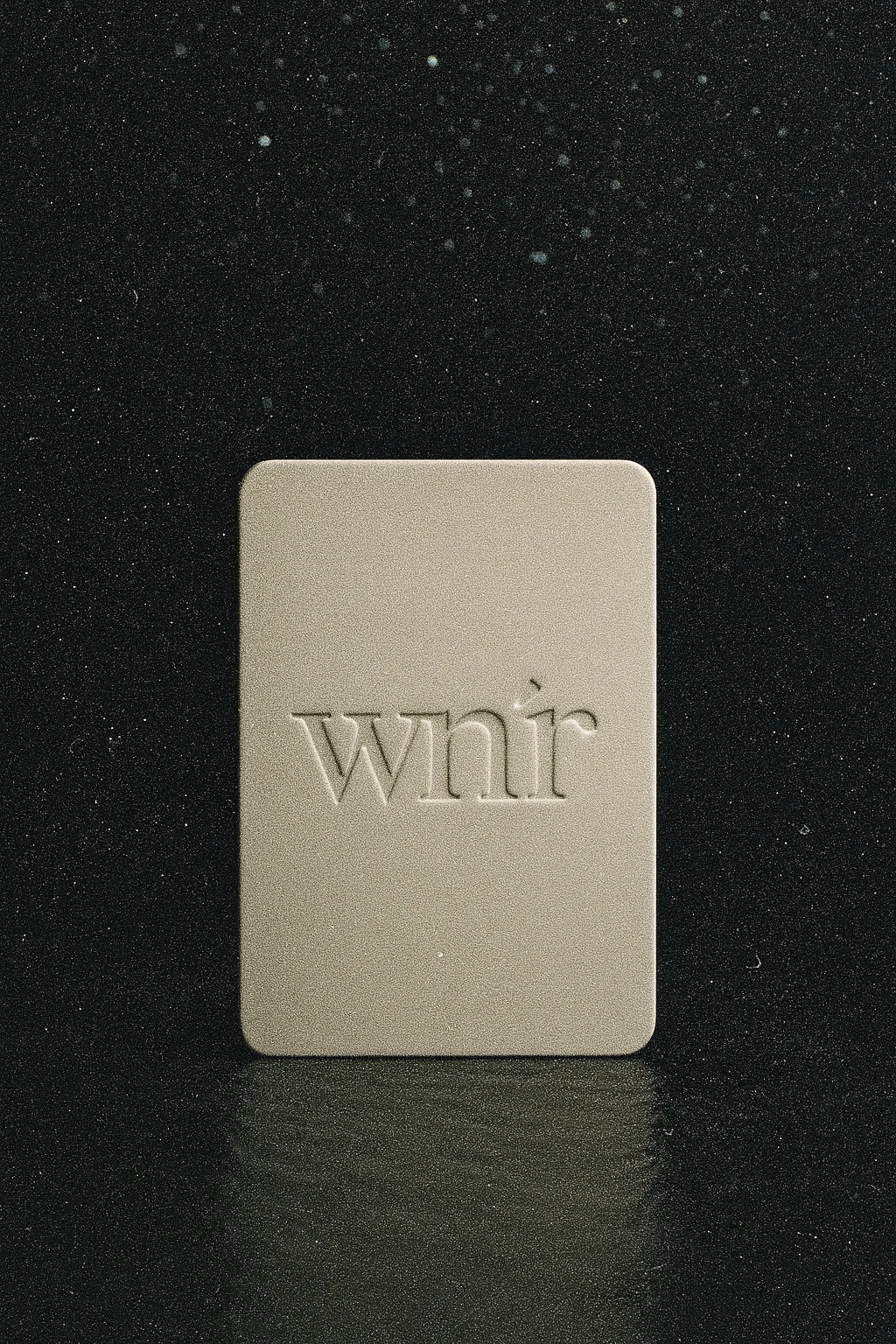 Person enjoying a moment of calm and subtle luxury, reading or having coffee